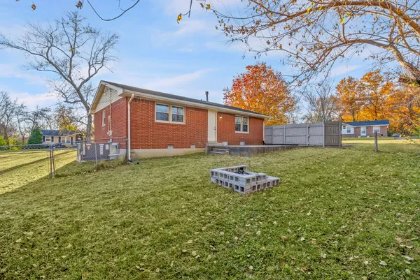 a front view of a house with a big yard