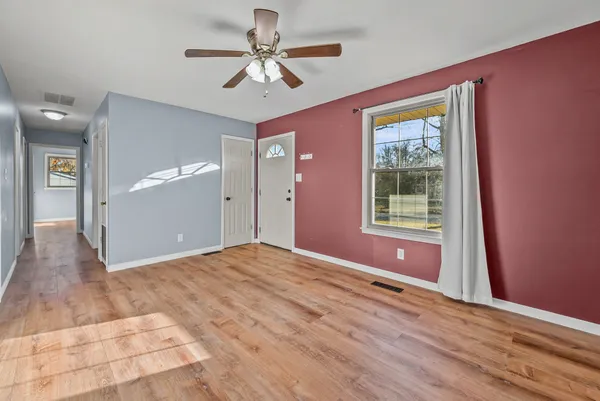 a view of an empty room with a window