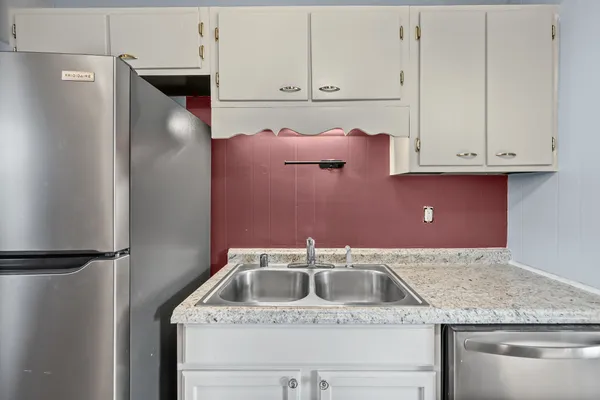 a kitchen with a sink and cabinets