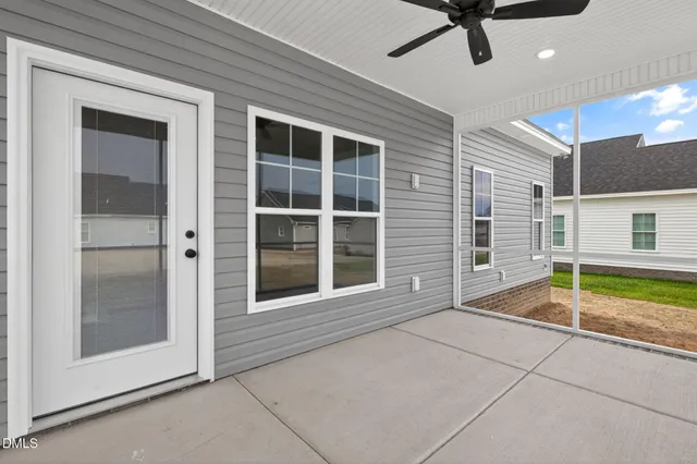 a view of a livingroom with a patio and a yard