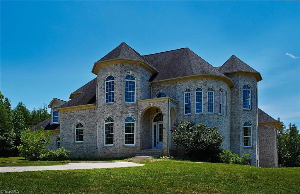 Beautiful all brick custom home on 10.2 acres built by current owner! Note the circular driveway.