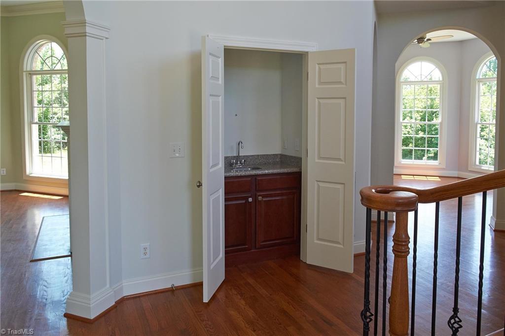 602 Bobcat Road Summerfield, NC 27358 - Photo 14 of 30 Wet bar is located between the living room on the left, and the office on the right. Great for entertaining!