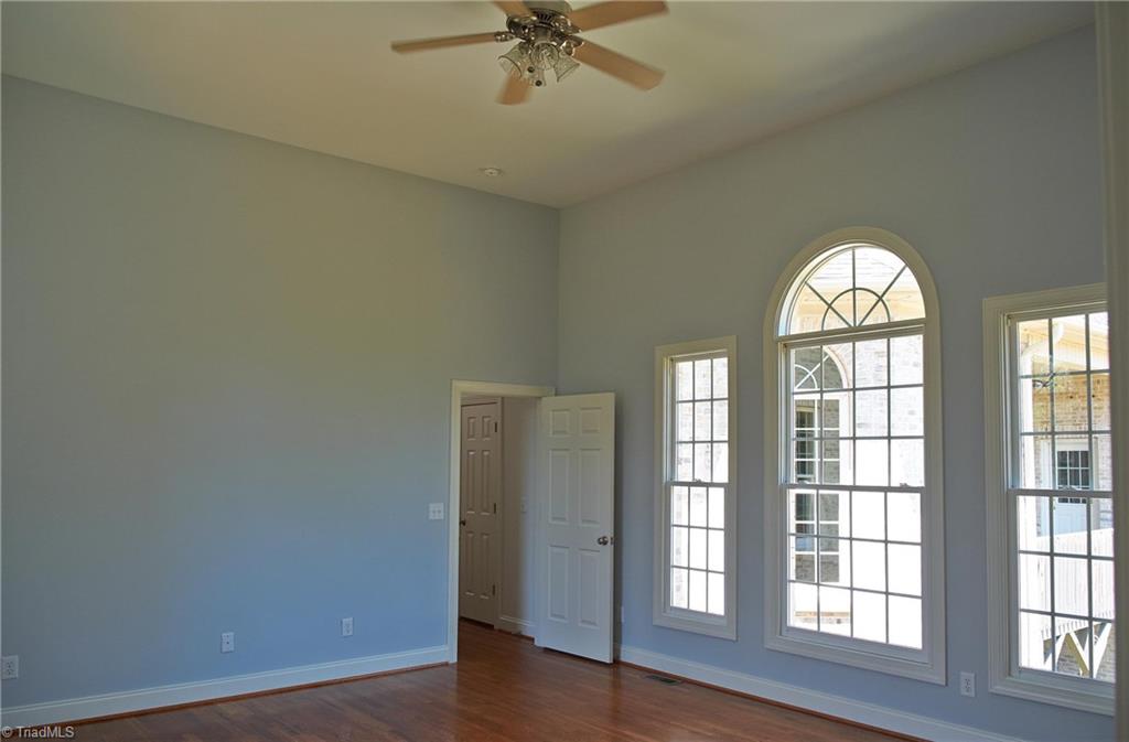 602 Bobcat Road Summerfield, NC 27358 - Photo 15 of 30 Huge master bedroom with lots of light. Look at the height of the ceilings!!