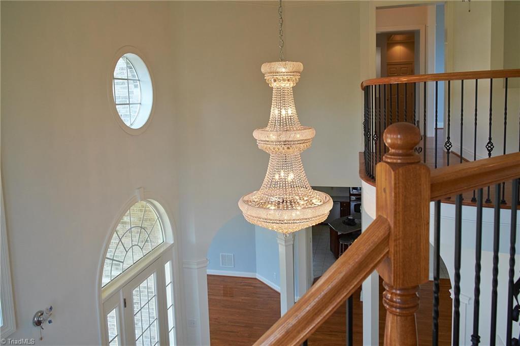 602 Bobcat Road Summerfield, NC 27358 - Photo 19 of 30 As you walk up the stairs, you get a better idea of the height of the ceilings and the beauty of the entry!