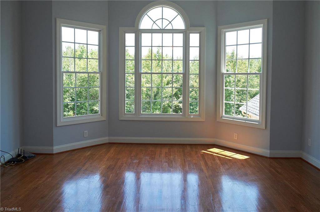 602 Bobcat Road Summerfield, NC 27358 - Photo 20 of 30 Large second story den with a view of the natural 10 acre lot. Original hardwood floors continue into the upstairs!