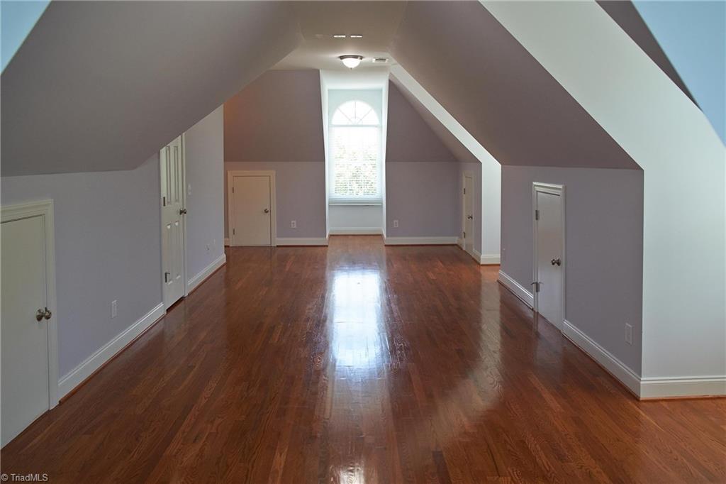 602 Bobcat Road Summerfield, NC 27358 - Photo 21 of 30 There's even a huge bonus room on the second story! This room is almost 30 X 12! There is a walk-in closet, as well as 5 doors leading into attic eave storage!