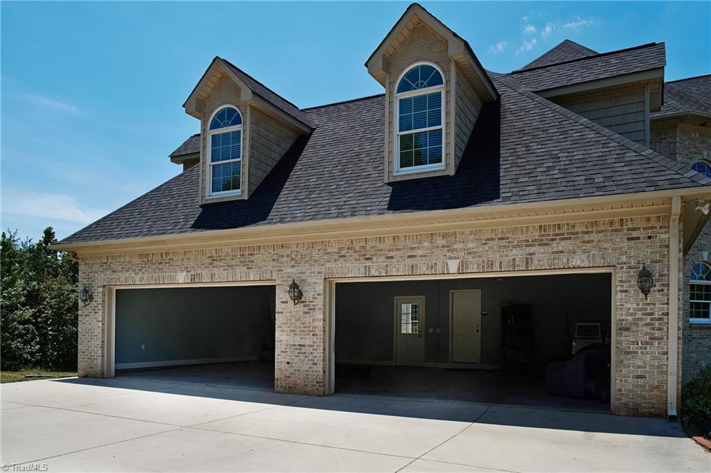 602 Bobcat Road Summerfield, NC 27358 - Photo 26 of 30 Spacious 4 car garage! There is a second washer/dryer connection in the corner on the right of the inside of the garage.