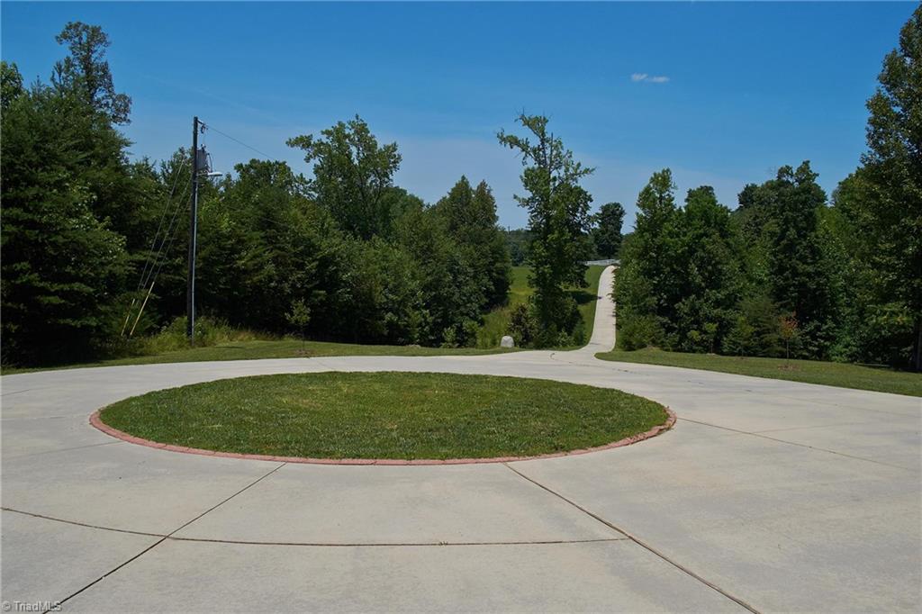 602 Bobcat Road Summerfield, NC 27358 - Photo 28 of 30 700 foot concrete driveway with a convenient circular drive!