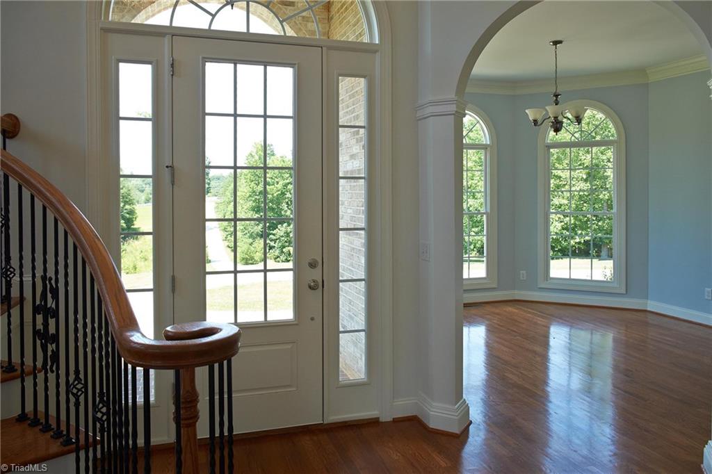 602 Bobcat Road Summerfield, NC 27358 - Photo 6 of 30 This home has high ceilings and many gorgeous floor-to-ceiling windows, making it bright and airy! Original hardwood floors.