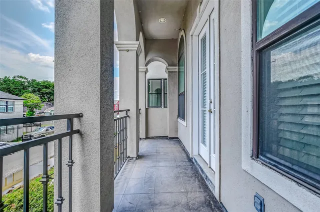 a kitchen with stainless steel appliances granite countertop a sink a stove and a wooden floors
