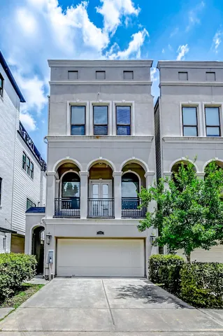 a front view of residential houses with stairs