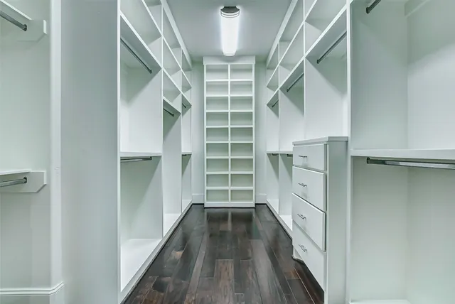 a bathroom with cabinet and window