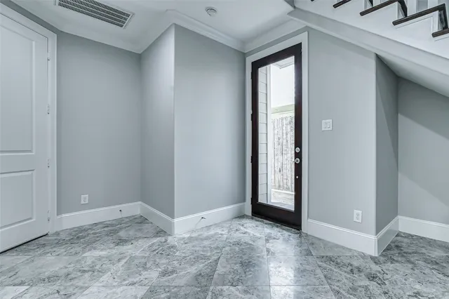 a view of entry way with wooden door