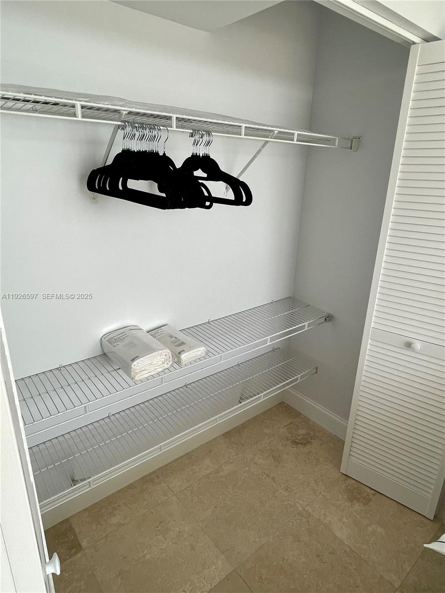 8911 Collins Avenue, Unit 1201 Surfside, FL 33154 - Photo 14 of 27 a view of a air conditioner and window in a room