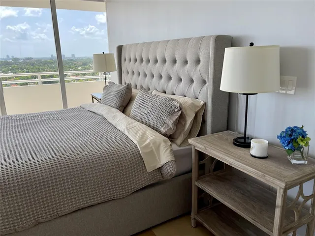 a bed room with a bed and a table