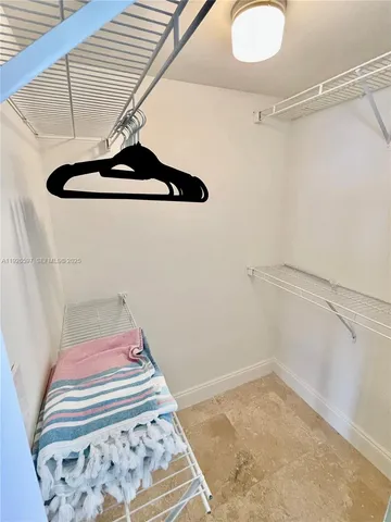 a view of a room with racks on the wall