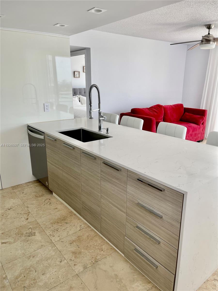 8911 Collins Avenue, Unit 1201 Surfside, FL 33154 - Photo 7 of 27 a close view of sink and tap