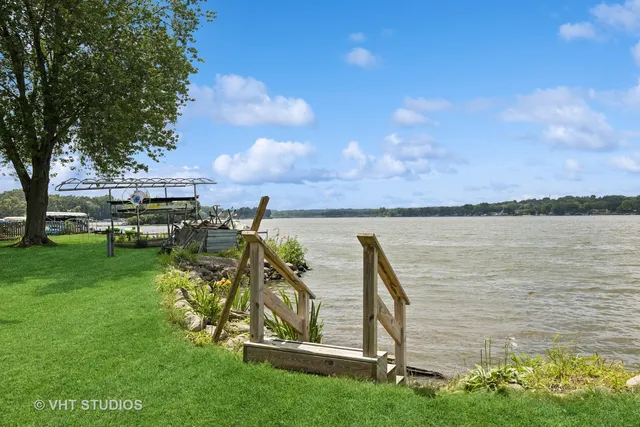 a view of a lake with houses in the back