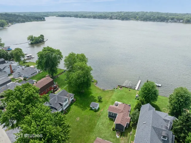 a aerial view of a house with a lake view