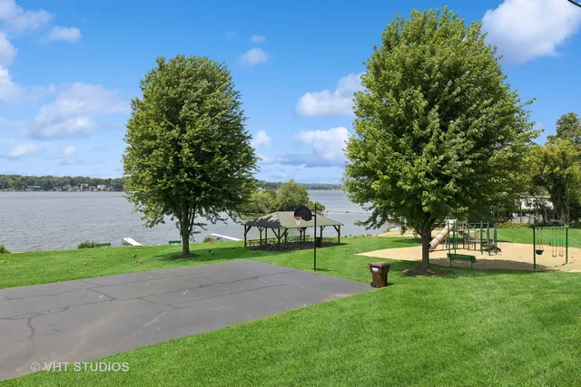 a view of a park with large trees