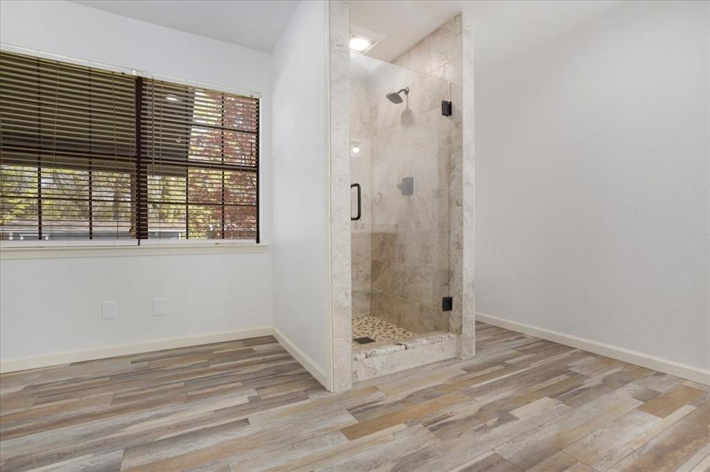 186 Mill Creek Resort Road Pottsboro, TX 75076 - Photo 20 of 40 a view of a bathroom with a window
