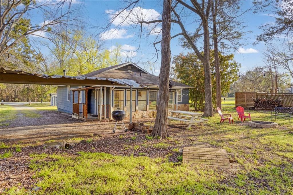 186 Mill Creek Resort Road Pottsboro, TX 75076 - Photo 32 of 40 a front view of a house with a yard
