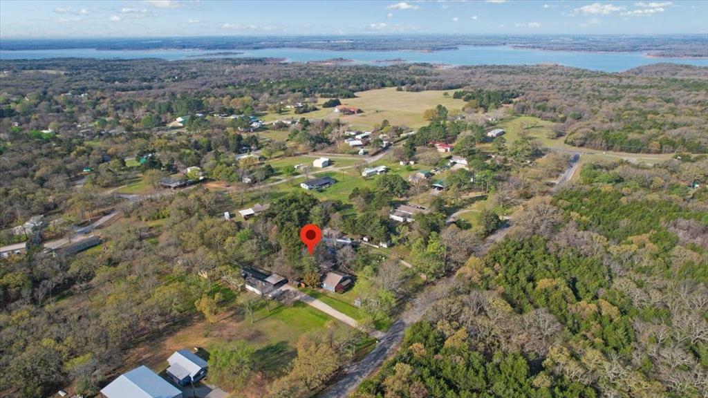 186 Mill Creek Resort Road Pottsboro, TX 75076 - Photo 37 of 40 an aerial view of a houses with beach