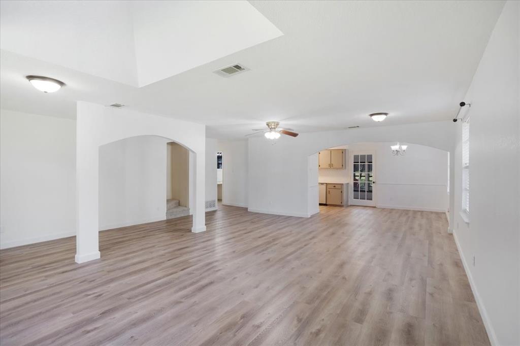 186 Mill Creek Resort Road Pottsboro, TX 75076 - Photo 6 of 40 a view of a big room with wooden floor and a window