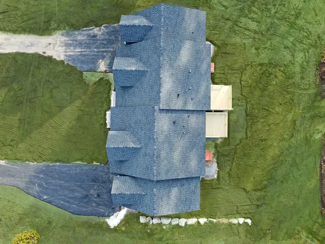 a picture of a bench in front of a wall