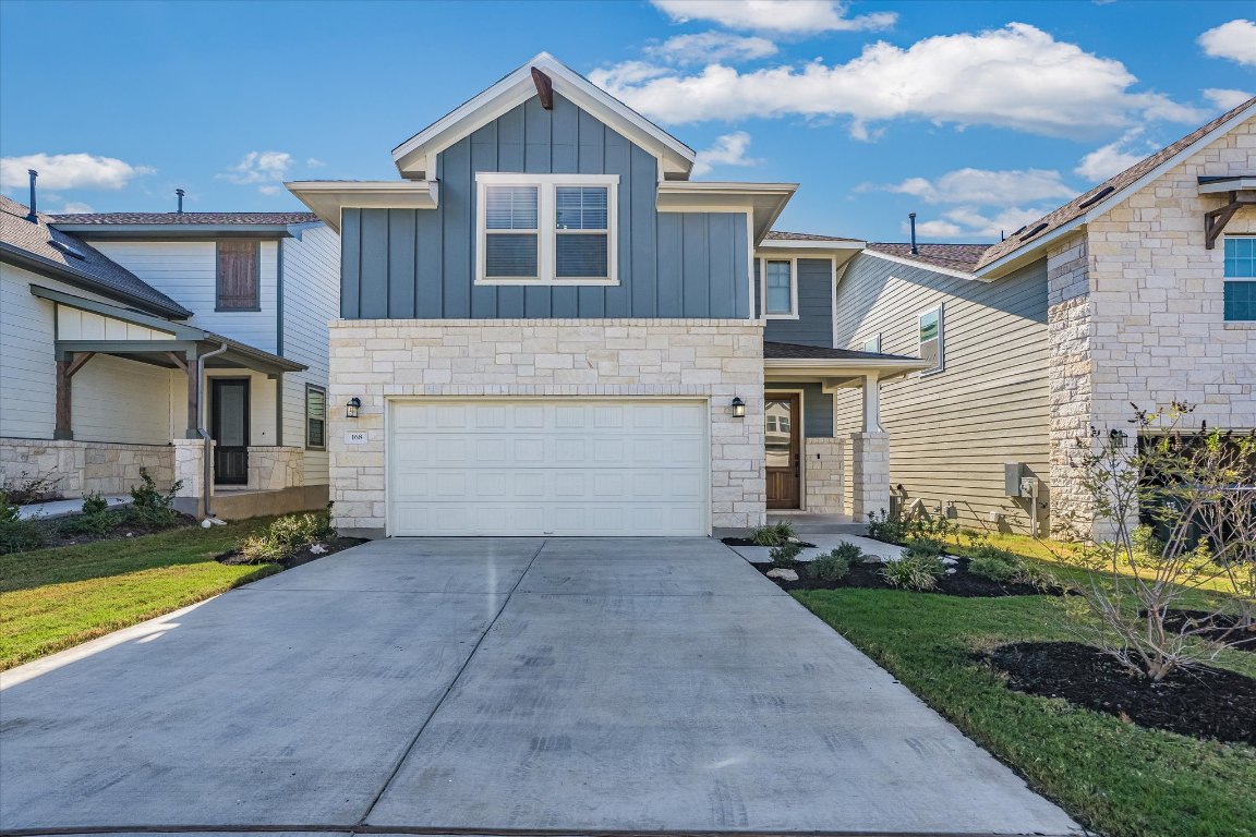 168 Kings Cyn Drive Dripping Springs, TX 78620 - Photo 1 of 25 a front view of a house with a yard
