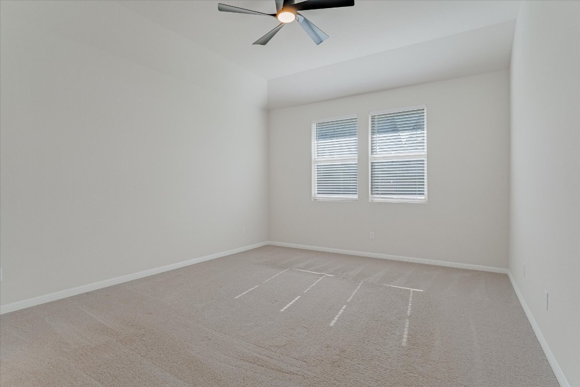 168 Kings Cyn Drive Dripping Springs, TX 78620 - Photo 11 of 25 an empty room with windows