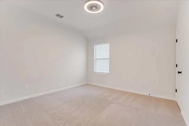 a bathroom with a tub a sink and mirror