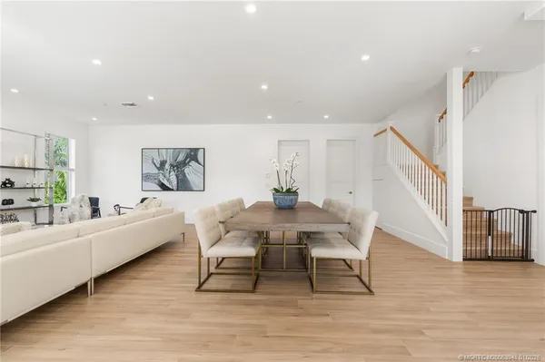 a view of a dining room with furniture window and wooden floor