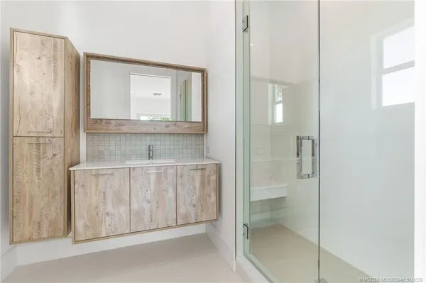 a bathroom with a tub and a window