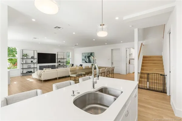 a kitchen with stainless steel appliances granite countertop a stove and a refrigerator
