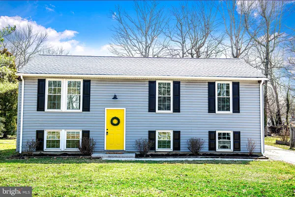 a front view of building with yard