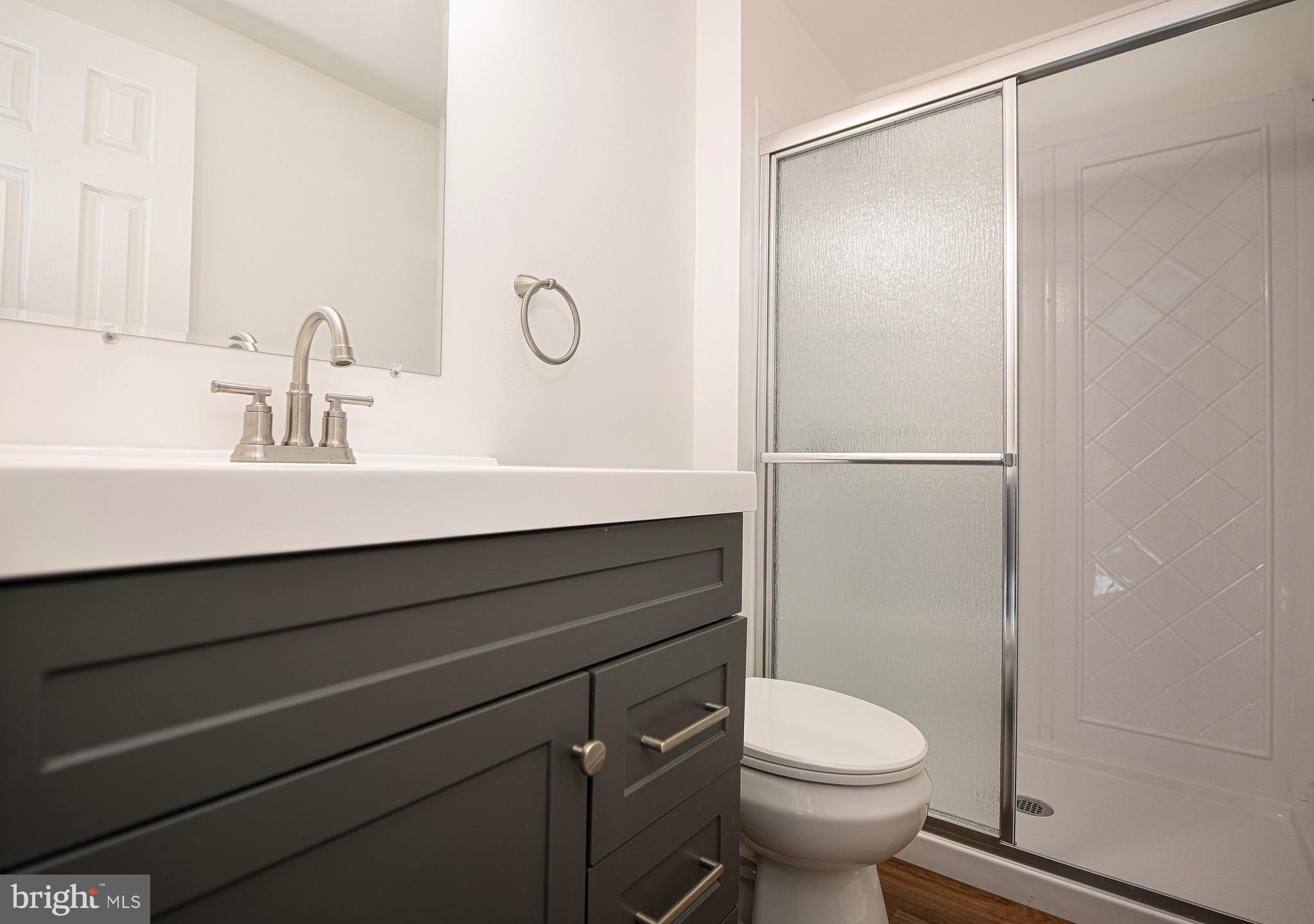 1811 Cape May Road Essex, MD 21221 - Photo 17 of 34 a bathroom with a sink and a toilet