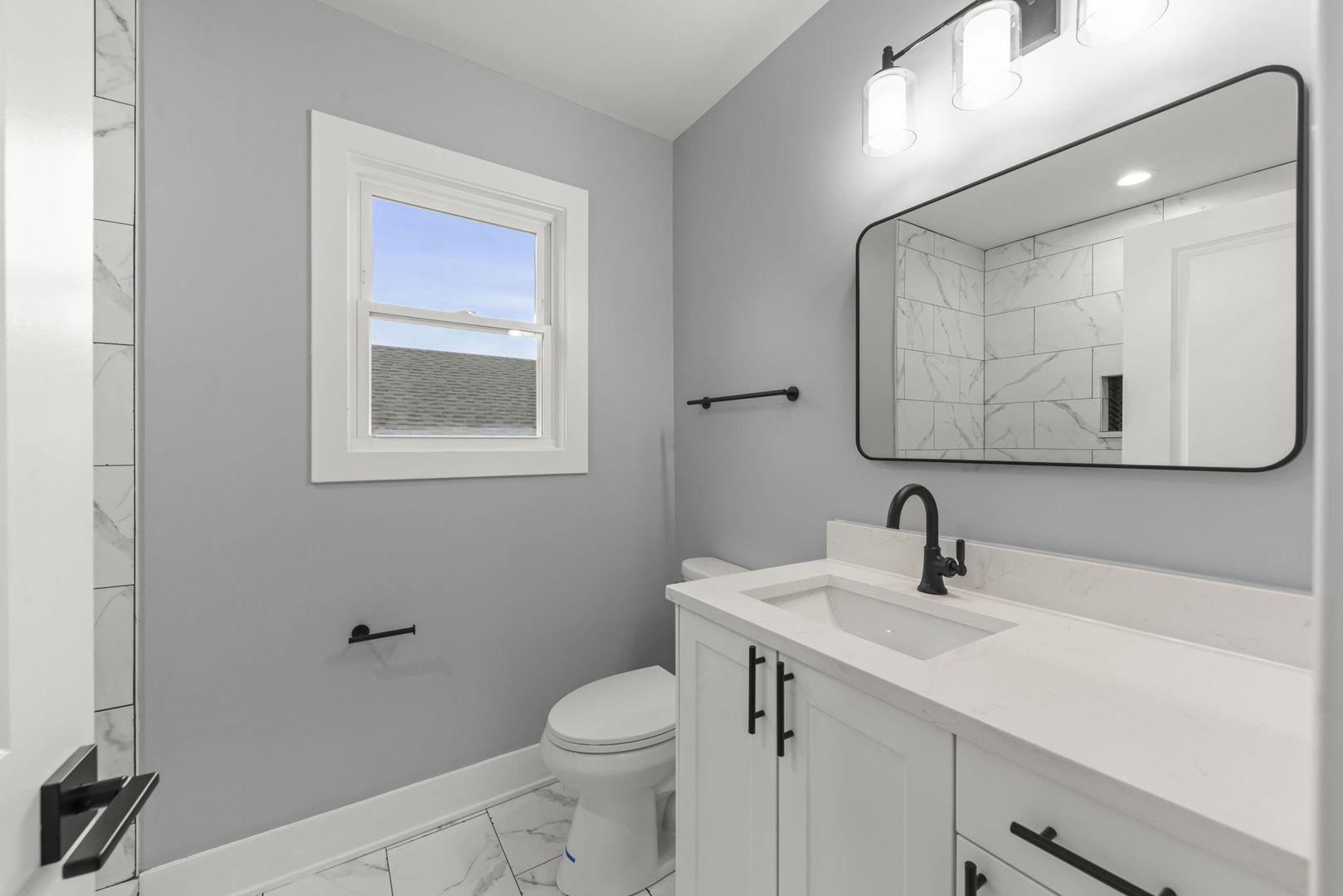 7600 West 60th Street Summit, IL 60501 - Photo 11 of 22 a bathroom with a toilet sink and mirror