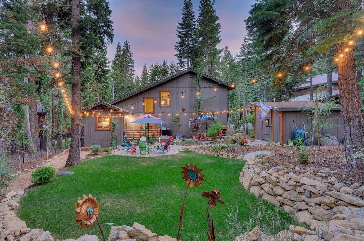 a front view of a house with swing and plants