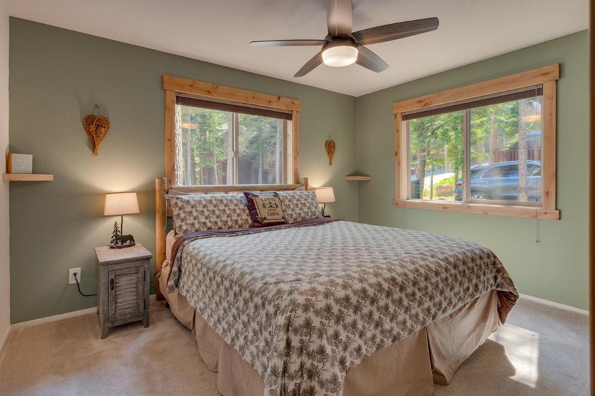 730 Cascade Circle Homewood, CA 96141 - Photo 13 of 22 a bedroom with a large bed and a window