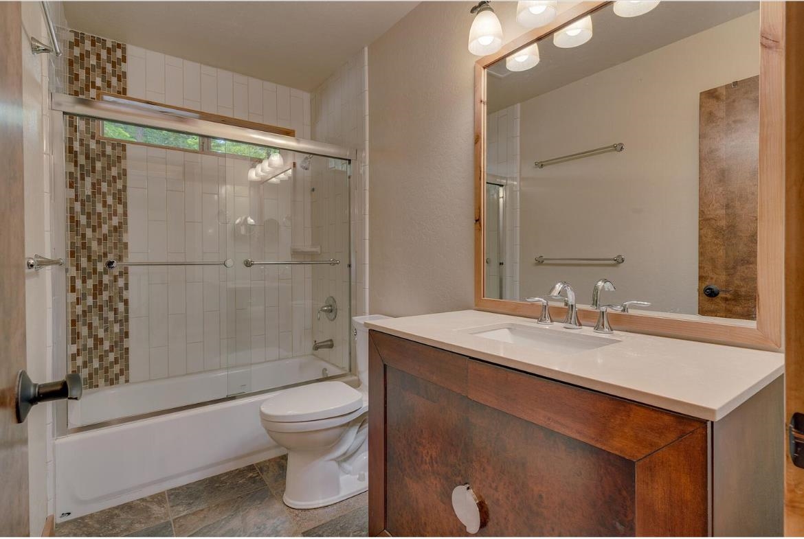 730 Cascade Circle Homewood, CA 96141 - Photo 15 of 22 a bathroom with a sink a toilet and shower