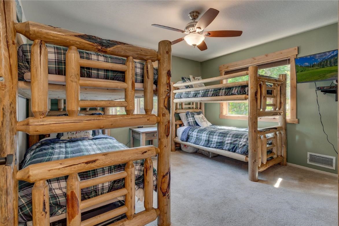 730 Cascade Circle Homewood, CA 96141 - Photo 17 of 22 a bedroom with bed and a large window