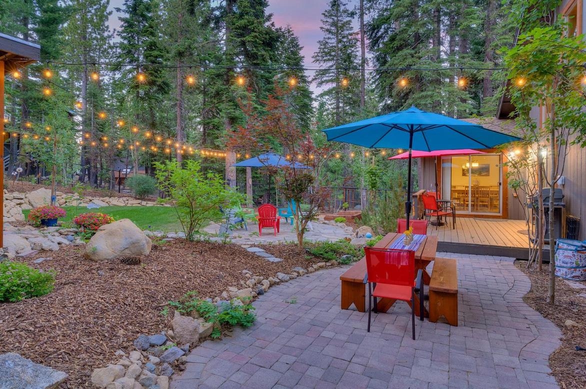 730 Cascade Circle Homewood, CA 96141 - Photo 2 of 22 a view of a backyard with furniture and a fire pit