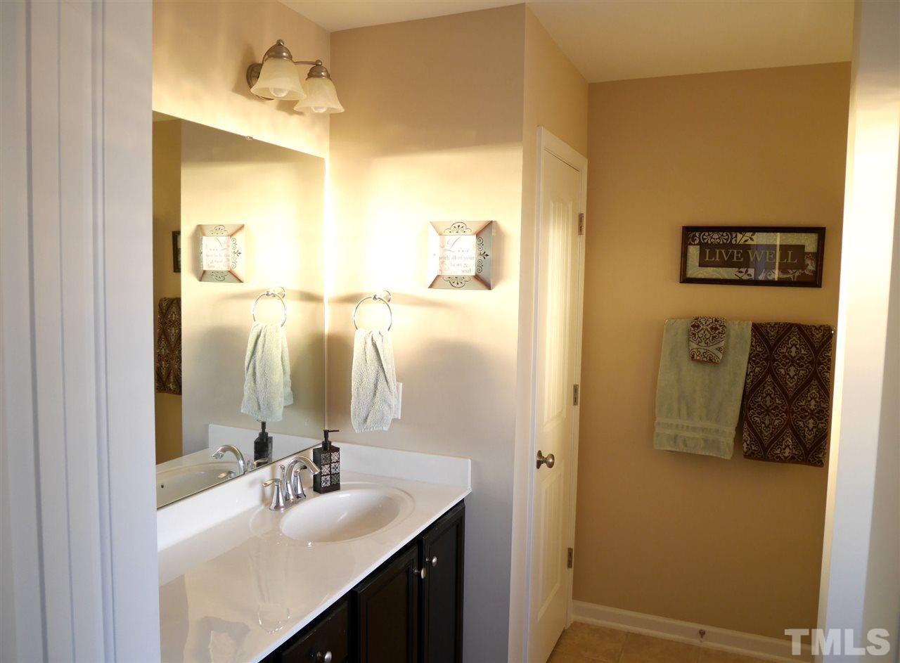 2802 Armadale Lane Raleigh, NC 27616 - Photo 11 of 25 Double sinks, private water closet and glassed shower featuring corner seat
