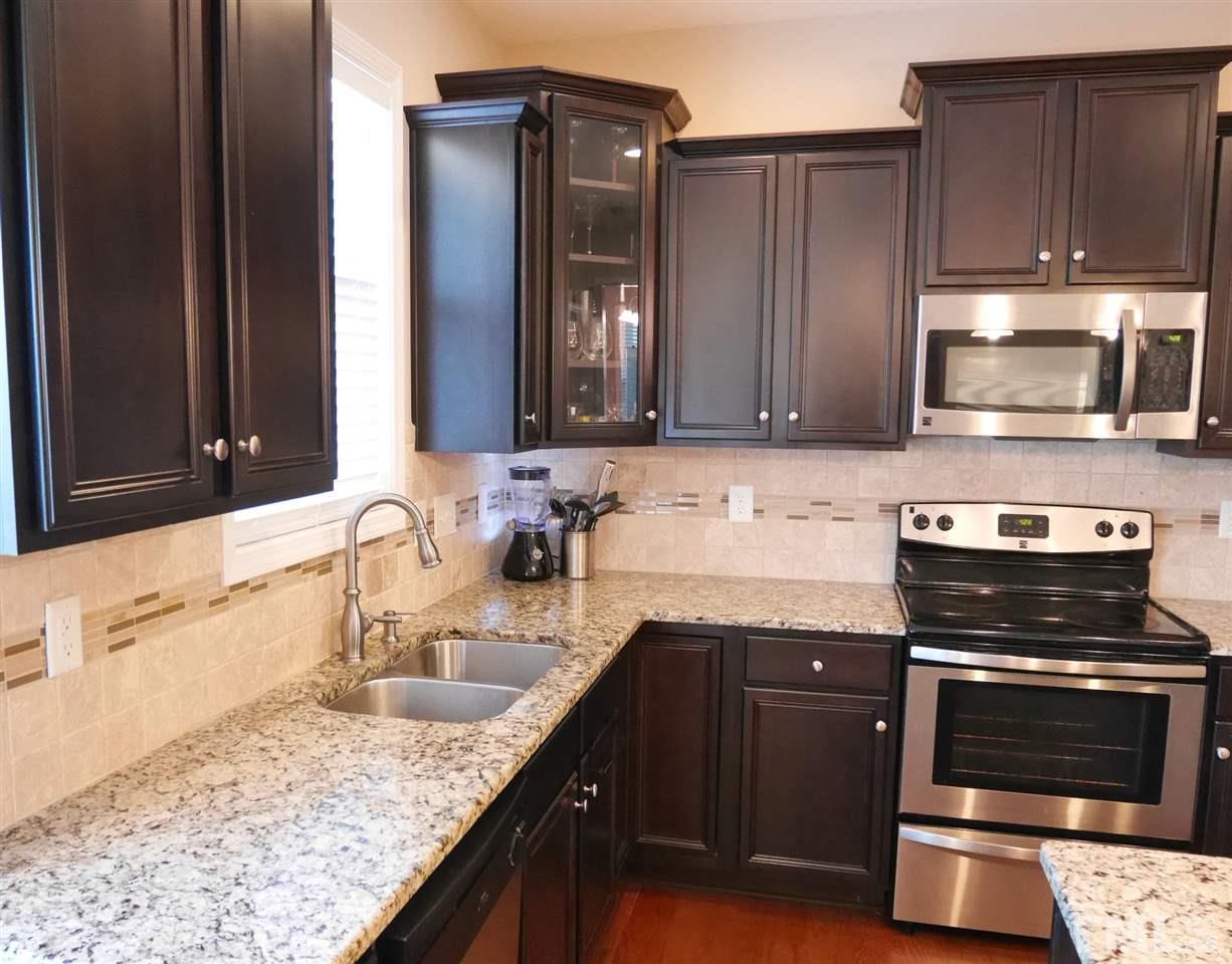 2802 Armadale Lane Raleigh, NC 27616 - Photo 8 of 25 Loads of counter space featuring Granite counter-tops and stainless appliances.