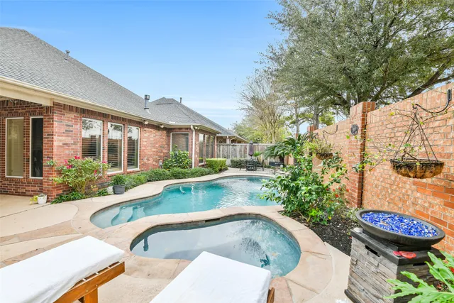 a view of a swimming pool with a patio