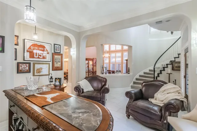 a living room with furniture and a table