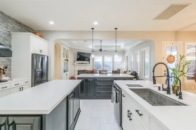 a large kitchen with a table and chairs