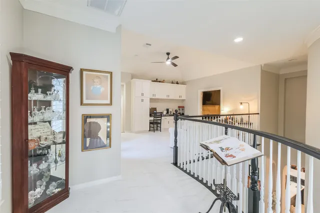 a kitchen with stainless steel appliances kitchen island granite countertop a refrigerator and cabinets