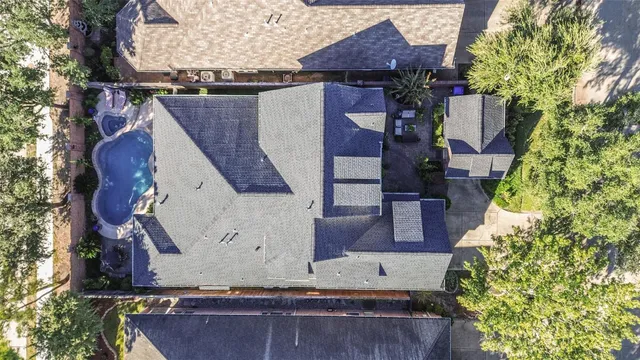 an aerial view of residential houses with outdoor space